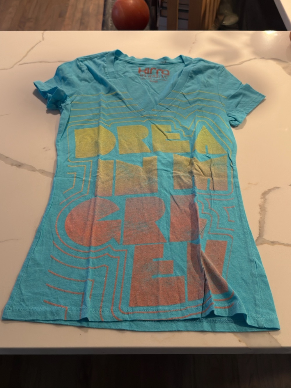 Kirra Aqua V-Neck Tee with Yellow and Coral Graphic